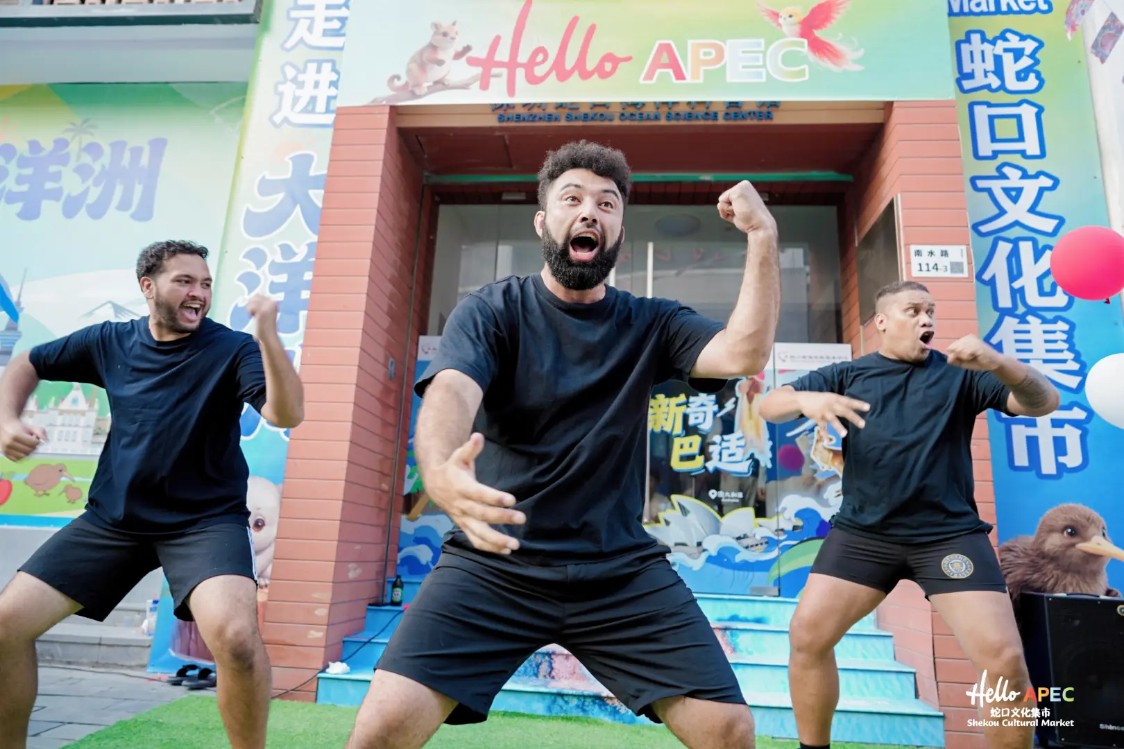 Three performers presenting a haka at Hello APEC